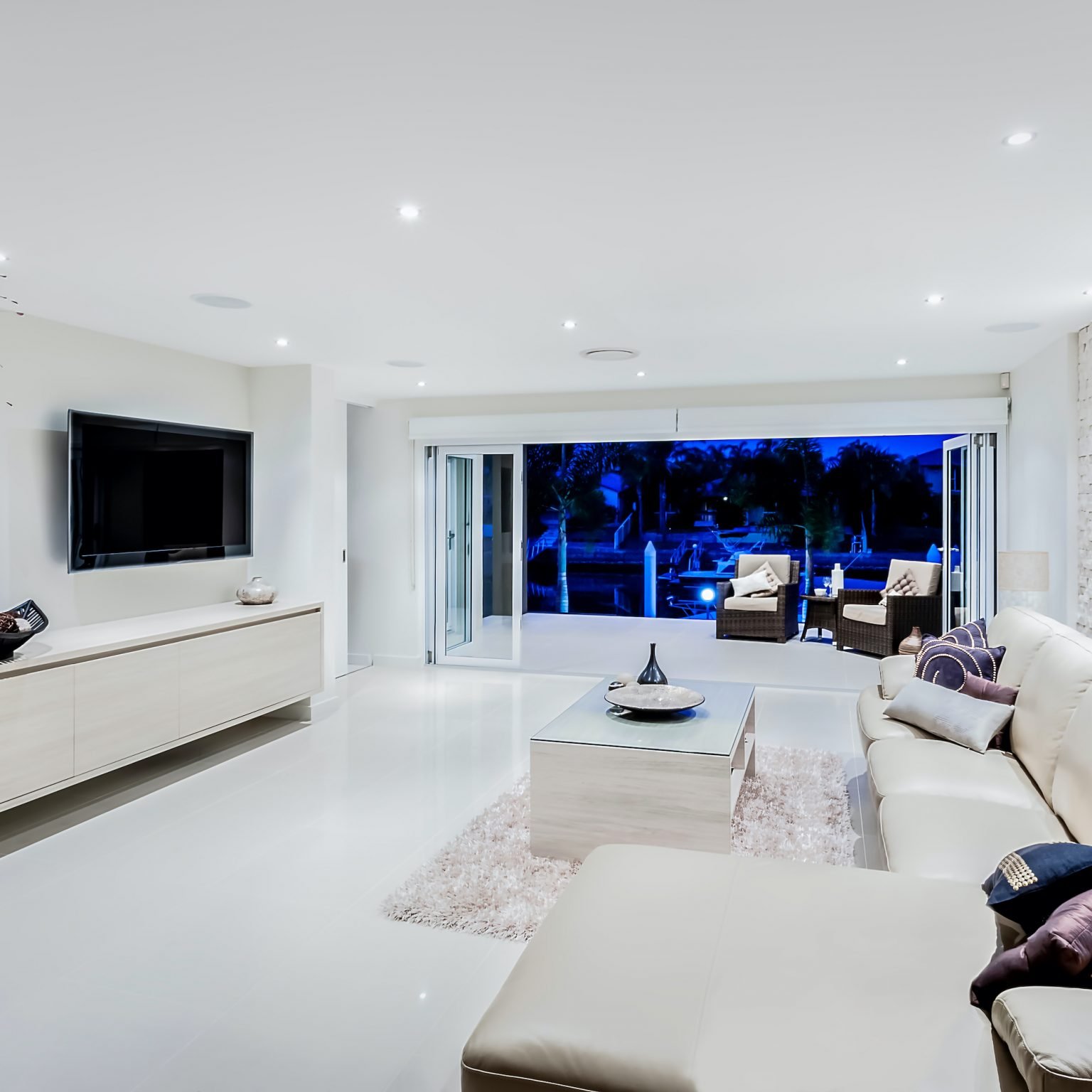 luxury living room with ob72 bifolding doors