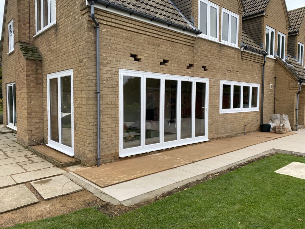 Origin slimline bifold doors to a new build house with matching french doors and window
